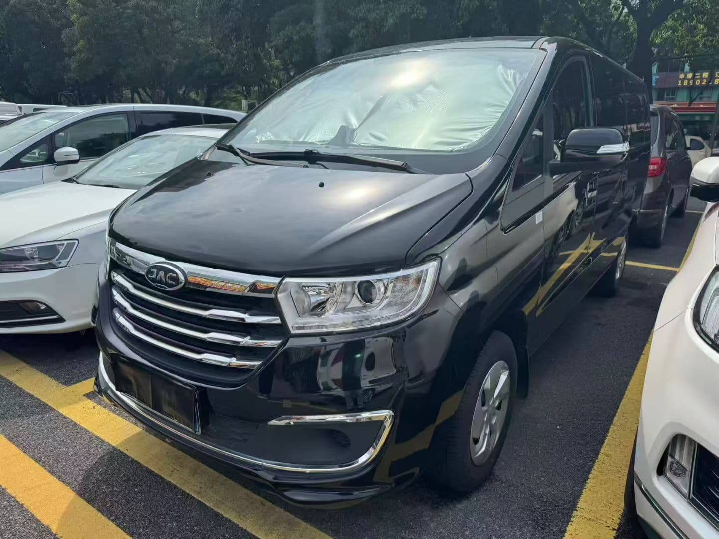 Black JAC passenger van shown as a user-provided commercial vehicle reference