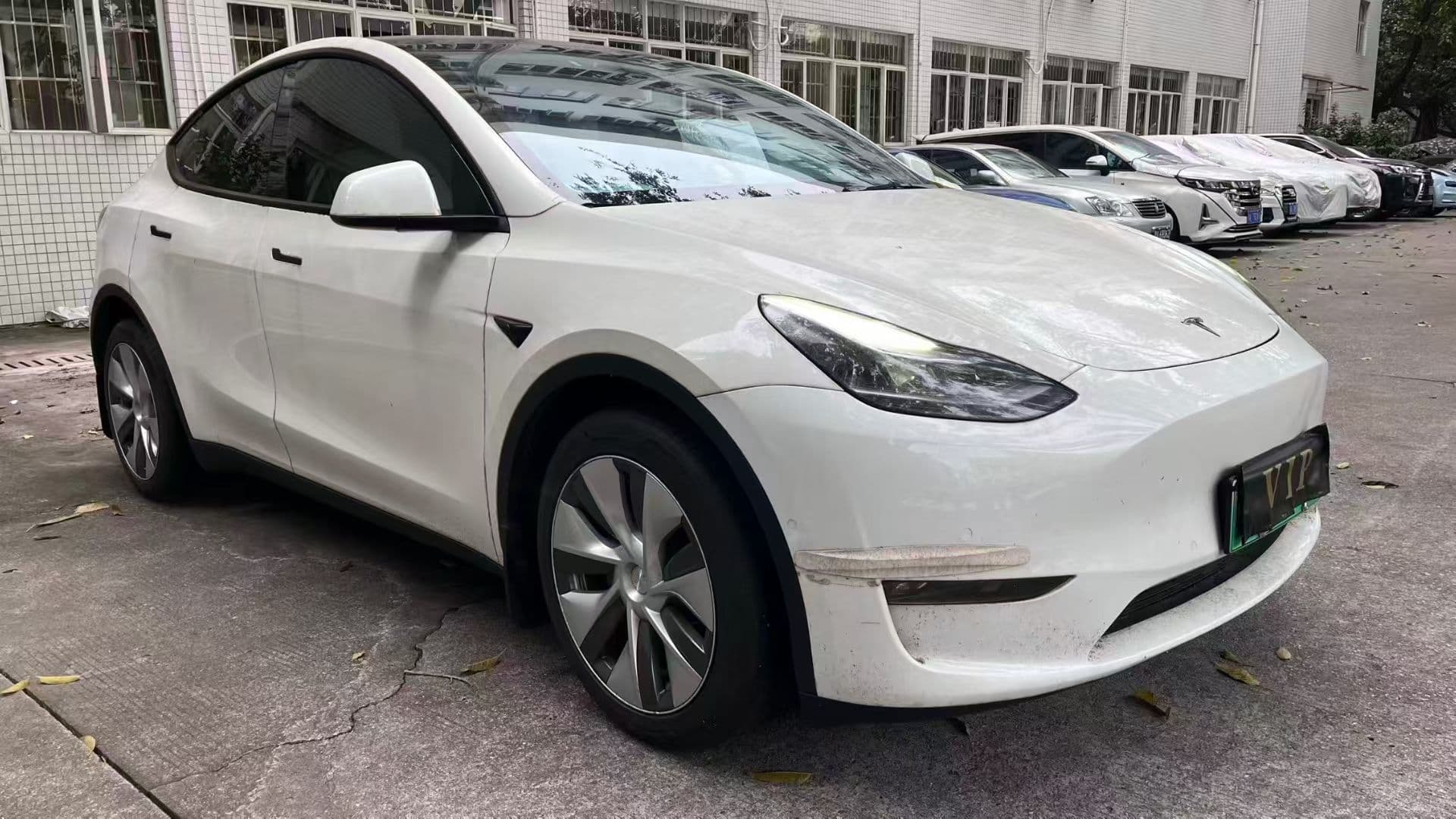 White Tesla Model Y shown as a user-provided electric vehicle reference
